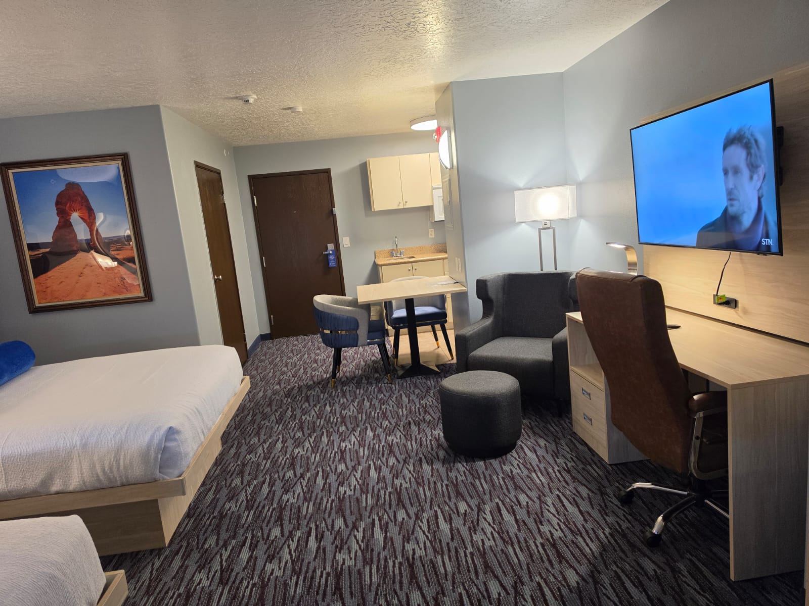 Full view of a Studio Two Queen showing entrance, kitchenette, seating and desk — Best Western Vernal Inn, Vernal Utah