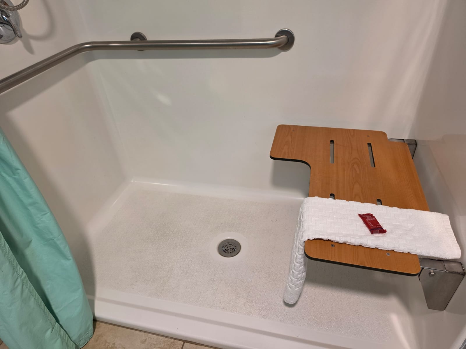Roll-in shower with grab bar and fold-down seat — accessible room, Best Western Vernal Inn, Vernal Utah