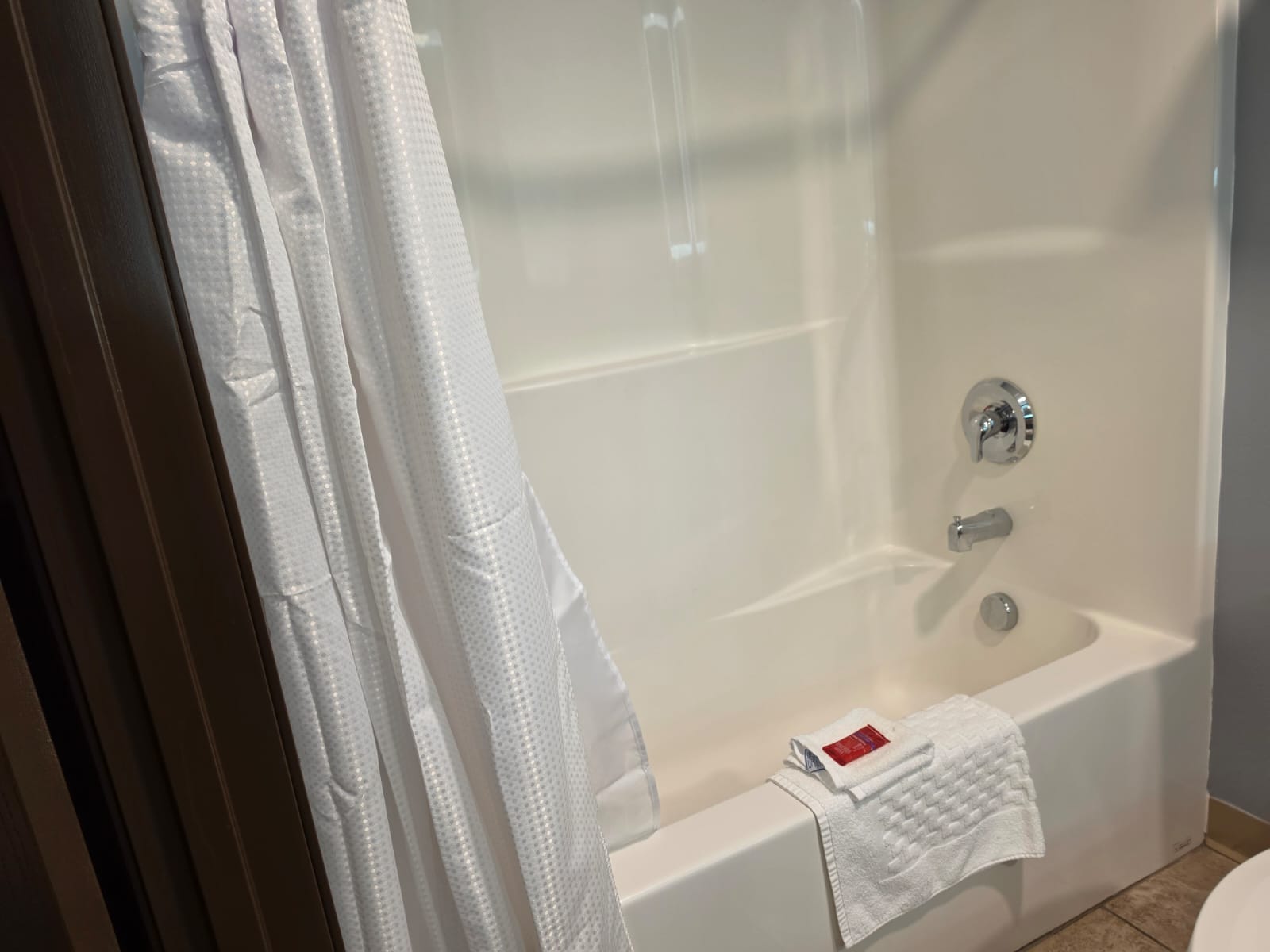 Tub and shower seen from the bathroom doorway — Best Western Vernal Inn, Vernal Utah
