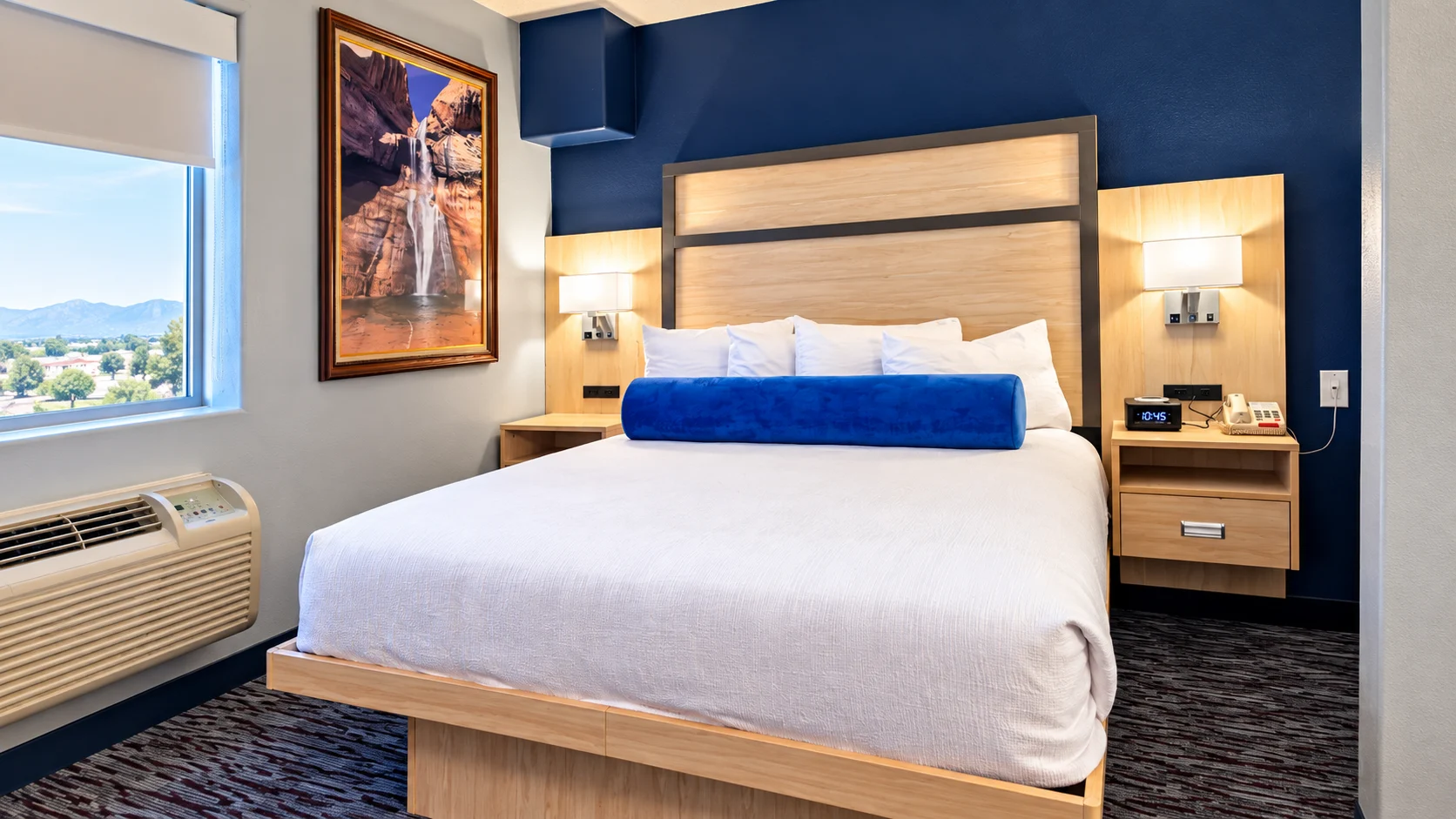 Queen bed beside a shaded window and heating and cooling unit — Best Western Vernal Inn, Vernal Utah